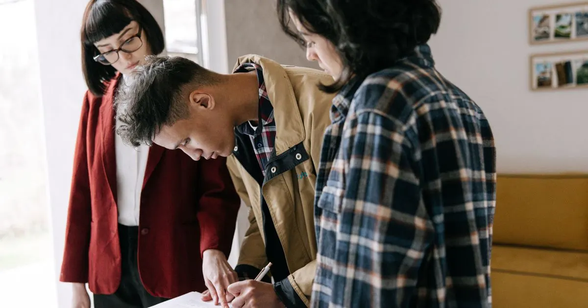 Canadian couple reviewing an installment loan agreement with an advisor